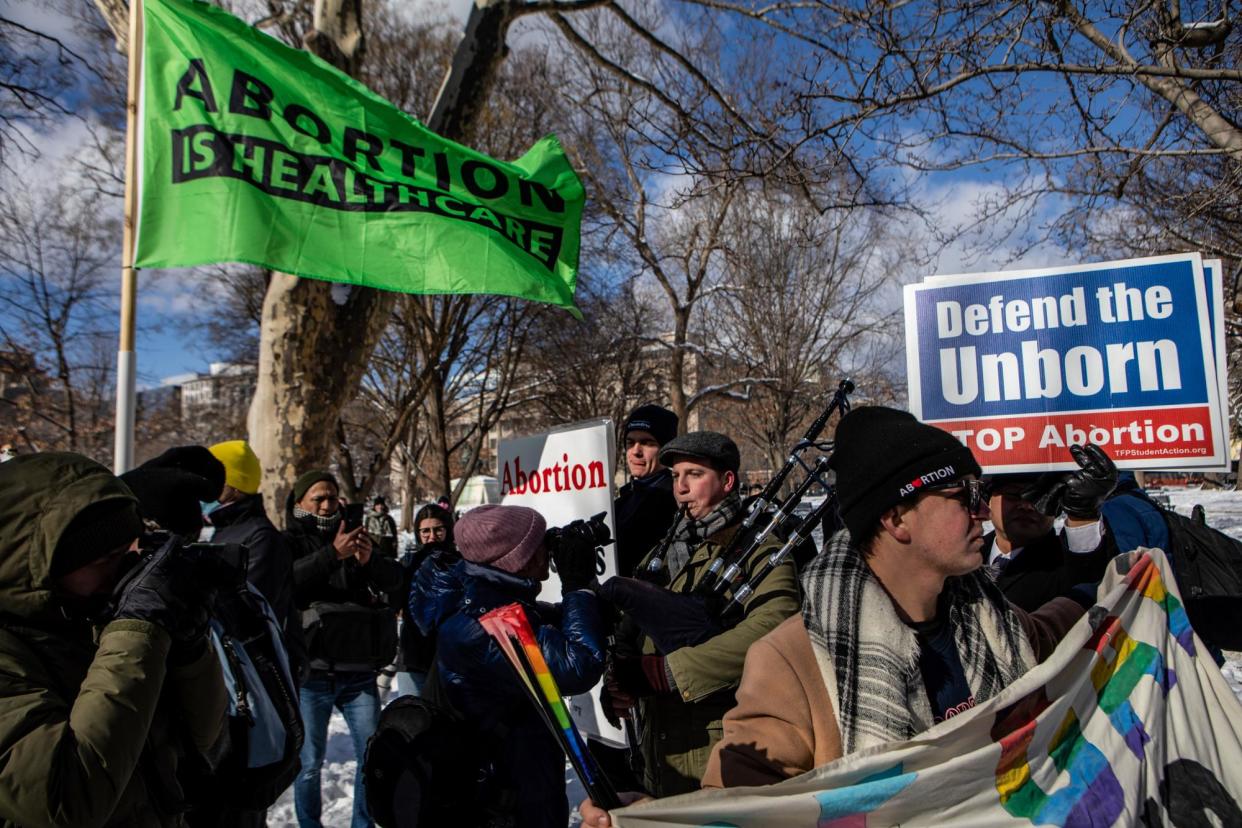 <span>Abortion rights supporters and opponents protest in Washington DC on 20 January 2024.</span><span>Photograph: Anna Rose Layden/Getty Images</span>