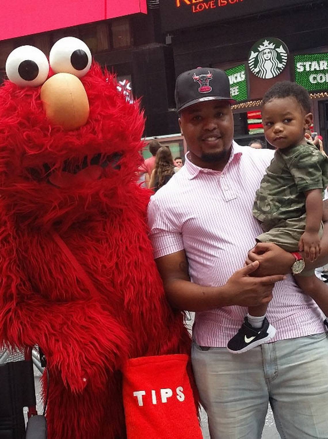 Anthony Johnson Jr. and nephew Corbin with Elmo.