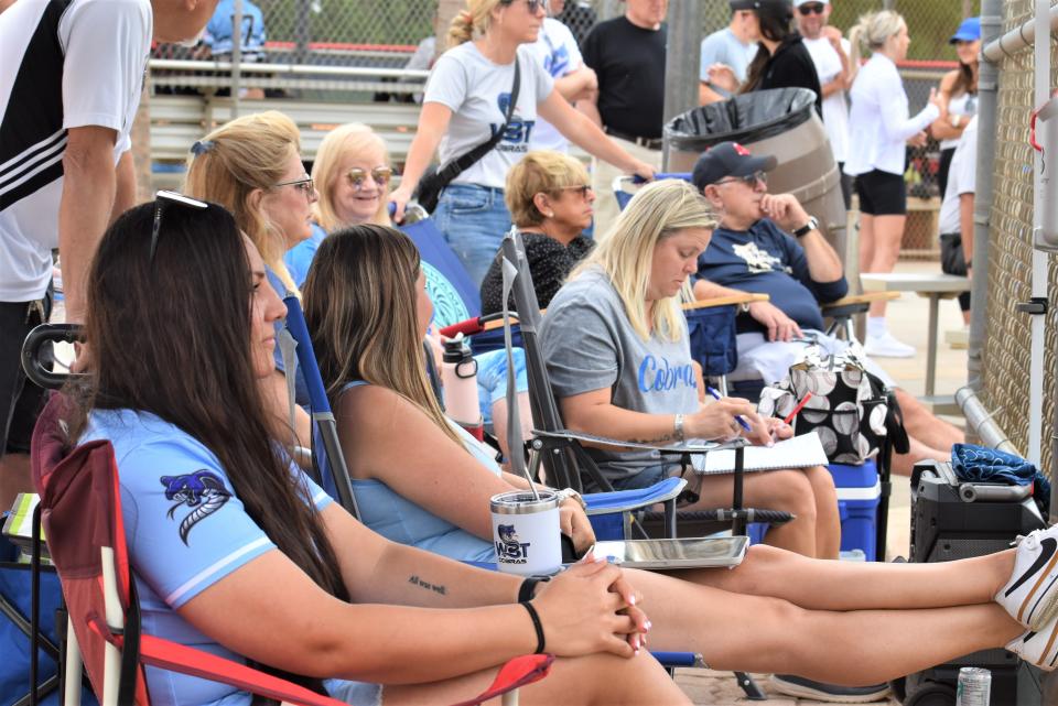 Fans gather to watch behind home plate as the West Boynton Travel league's Cobras play an 8U game in Boynton Beach, Florida on April 28, 2024.