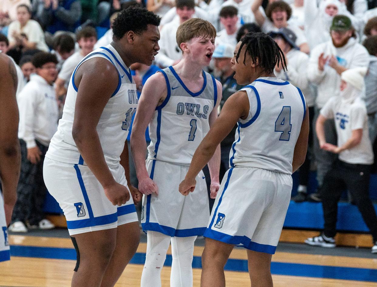 Bensalem's Jaidyn Moffitt (31) and Antonio Morris (1) celebrate with teammate Amir Drummond (4).