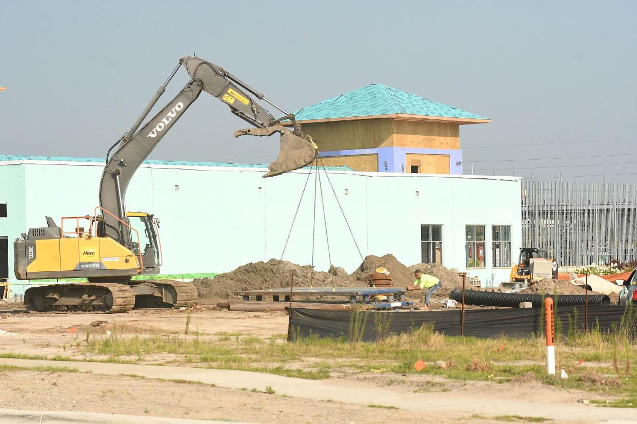 Construction continues on many of the new businesses growing up around the Leland Town Center. A new Lowe's Home Improvement, 7-Eleven and car wash are just a few of the new sites under construction. KEN BLEVINS/STARNEWS