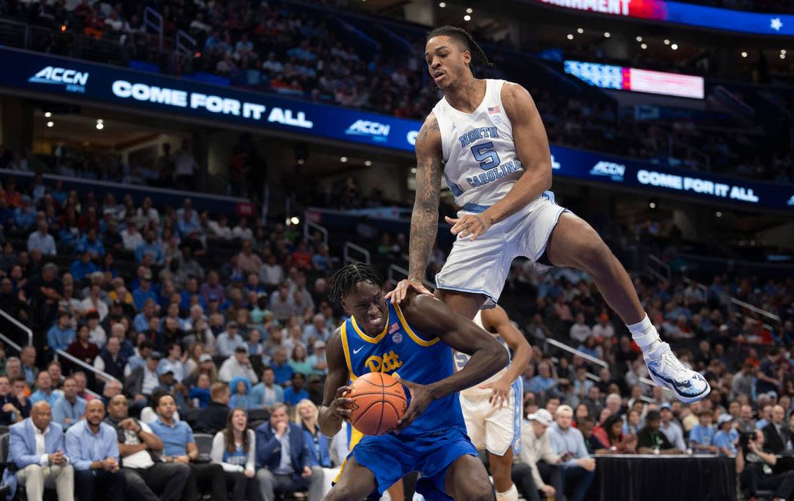 North Carolina’s Armando Bacot (5) defends Pittsburgh’s Frederiko Frederiko (33) during the first half in the semi-finals of the ACC Men’s Basketball Tournament at Capitol One Arena on Friday, March 15, 2024 in Washington, D.C.