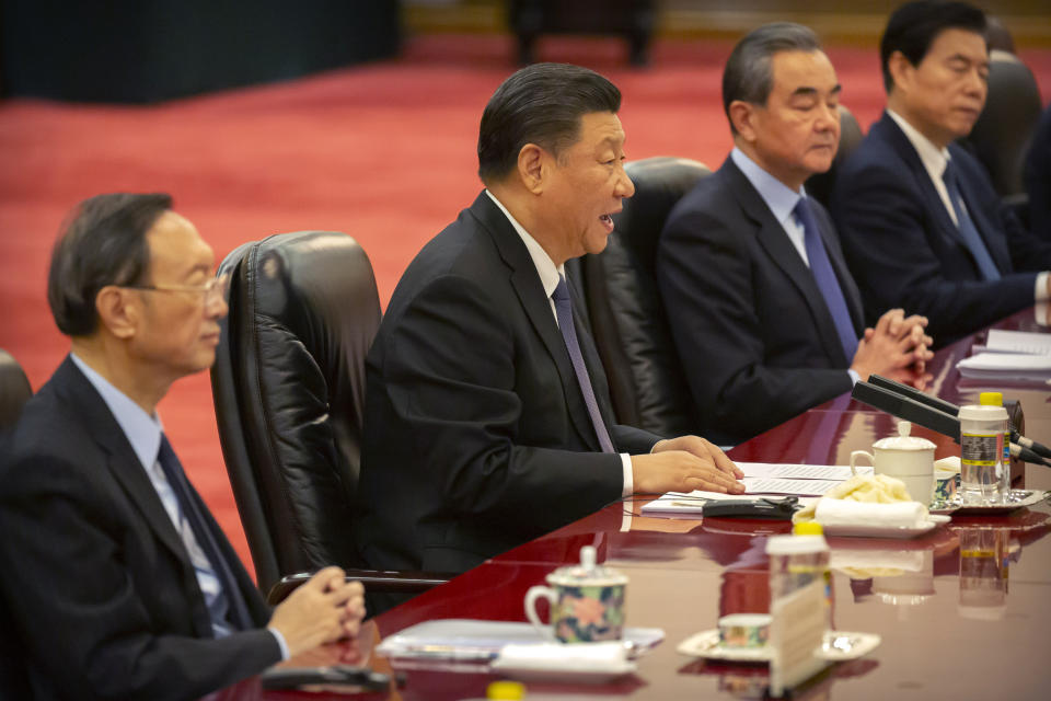 Chinese President Xi Jinping, center, speaks during a meeting with Kiribati's President Taneti Maamau at the Great Hall of the People in Beijing, Monday, Jan. 6, 2020. (AP Photo/Mark Schiefelbein, Pool)