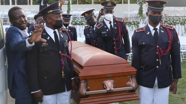 Soldiers of the Armed Forces of Haiti guard carry the casket of slain President Jovenel Moïse before his funeral