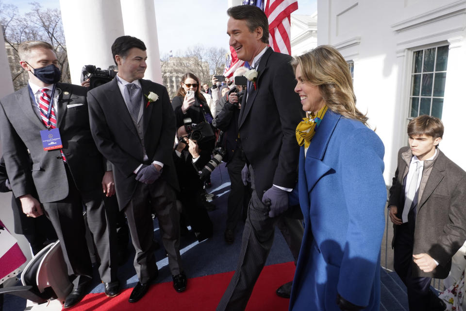 Gov. elect Glenn Youngkin with wife Suzanne Youngkin arrive before his inauguration ceremony, Saturday, Jan. 15, 2022, in Richmond, Va. (AP Photo/Steve Helber)