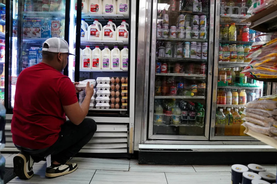 A person arranges groceries in El Progreso Market in the Mount Pleasant neighborhood of Washington, D.C., U.S., August 19, 2022. REUTERS/Sarah Silbiger