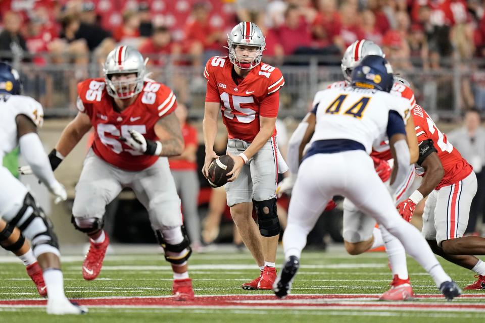 Sep 17, 2022; Columbus, Ohio, USA; Ohio State Buckeyes quarterback Devin Brown (15) takes a snap during the second half of the NCAA Division I football game against the Toledo Rockets at Ohio Stadium. Ohio State won 77-21. Mandatory Credit: Adam Cairns-The Columbus Dispatch