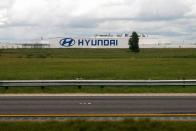 A Hyundai auto plant is seen from inside a Greyhound bus outside of Montgomery