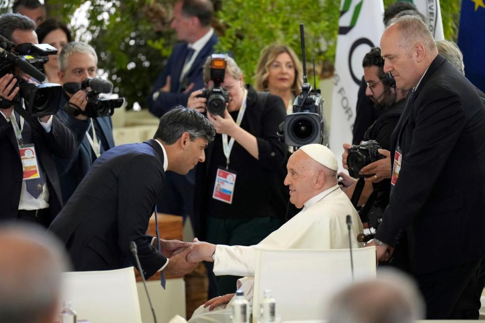 Rishi Sunak welcomes Pope Francis on day two of the 50th G7 summit at Borgo Egnazia, southern Italy (AP)