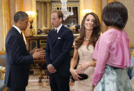 U.S. President Barack Obama (L) and first lady Michelle Obama (R) talk to Britain's Prince William (2nd L) and Catherine, Duchess of Cambridge at Buckingham Palace, in London May 24, 2011.