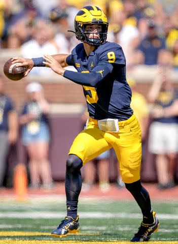 <p>Nic Antaya/Getty</p> J.J. McCarthy throws a pass against the Colorado State Rams during the second half on September 03, 2022 in Ann Arbor, Michigan.