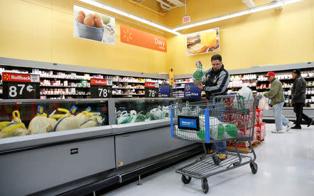 FILE PHOTO: A customer shops for a turkey at a Walmart store in Chicago, Illinois, U.S., November 20, 2018. REUTERS/Kamil Krzaczynski/File Photo