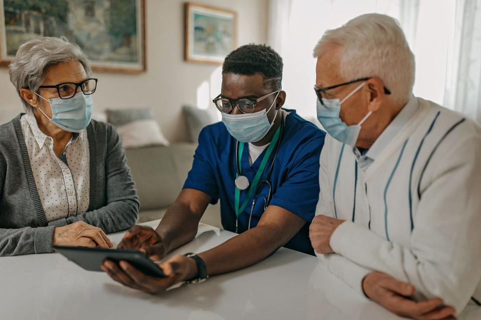 Doctor explaining how to use electronic medical record