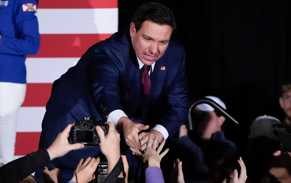 Ron DeSantis shakes hands with the crowd