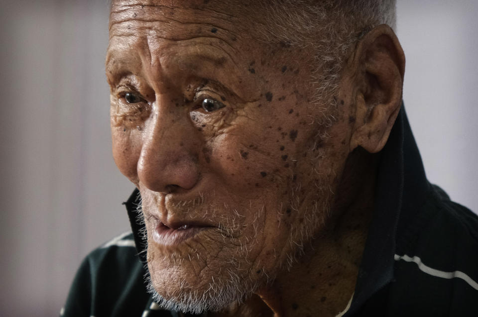 Vichuzo Rutsa, a 101-year-old Angami Naga, shares his memories of the bloody battle between the Japanese and British Commonwealth forces that took place in his village during World War II, in Kohima village, India, Wednesday, Aug. 12, 2020. For the locals, World War II was a conflict brought to their quiet lands by outsiders, and along with it, immeasurable loss. A population that had never been exposed to life beyond the village saw battle tanks and fighter planes dropping bombs over their beloved land. "We really suffered during the war," Rutsa said softly from his bed. (AP Photo/Yirmiyan Arthur)