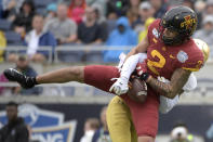 Iowa State wide receiver Sean Shaw Jr. (2) catches a pass for a 28-yard gain in front of Notre Dame cornerback Troy Pride Jr. during the first half of the Camping World Bowl NCAA college football game Saturday, Dec. 28, 2019, in Orlando, Fla. (AP Photo/Phelan M. Ebenhack)