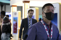 A visitor wears a mask at the Arab Health Exhibition in Dubai, United Arab Emirates, Wednesday, Jan. 29, 2020. The United Arab Emirates on Wednesday confirmed the first cases in the Mideast of the new Chinese virus that causes flu-like symptoms, saying doctors now were treating a family that had just come from a city at the epicenter of the outbreak. (AP Photo/Kamran Jebreili)