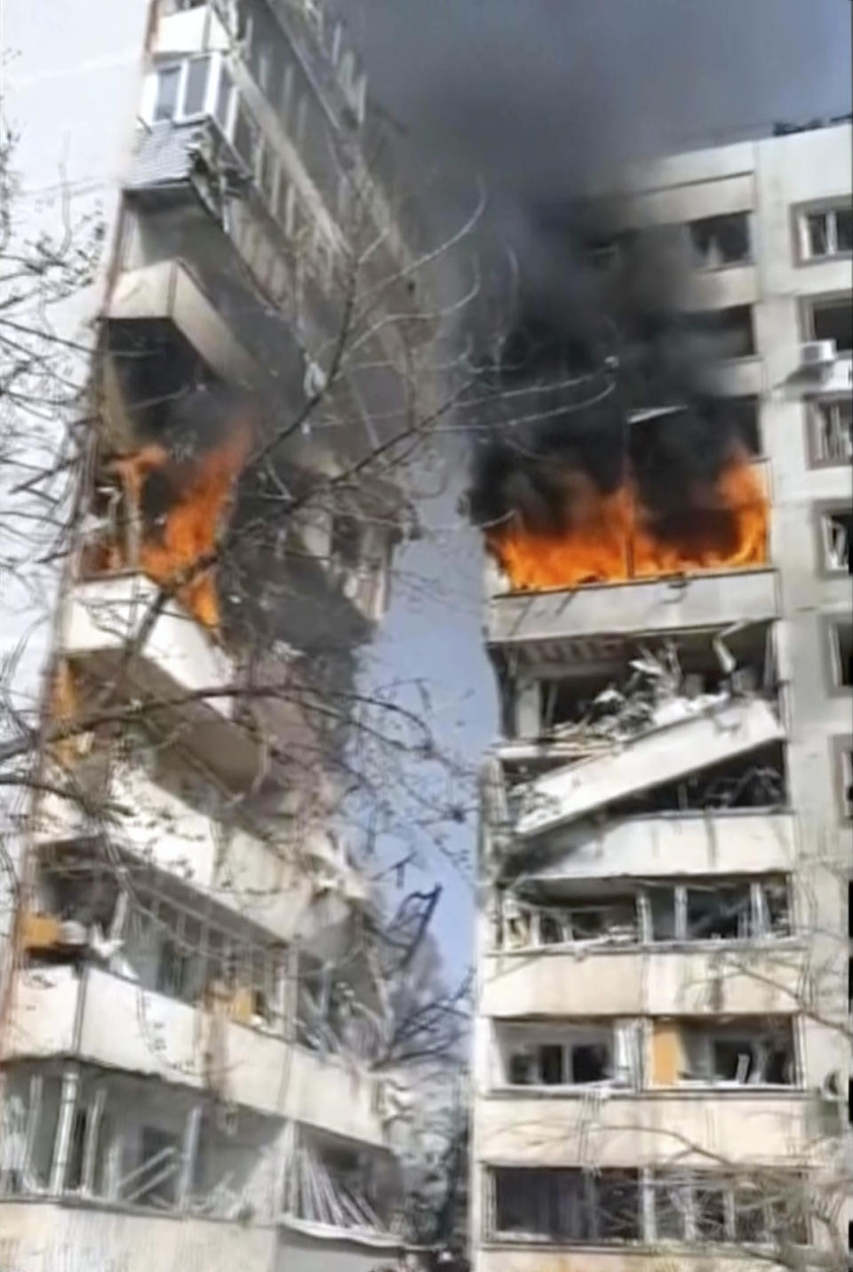 In this grab taken from video provided by Ukrainian Presidential Office, a residential multi-story building hit by a missile is on fire in southeastern city of Zaporizhzhia, Ukraine, Wednesday, March 22, 2023. (Ukrainian Presidential Office via AP)