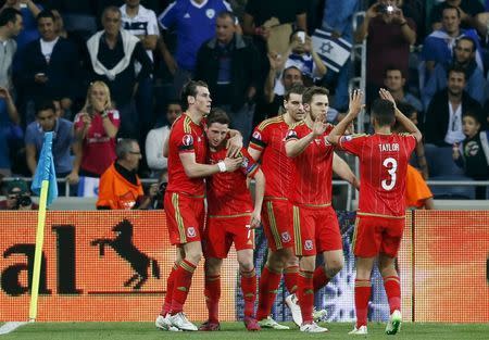 Wales' Gareth Bale (L) celebrates with team mates after scoring a goal during their Euro 2016 Group B qualifying soccer match against Israel at the Sammy Ofer Stadium in Haifa March 28, 2015. REUTERS/Nir Elias