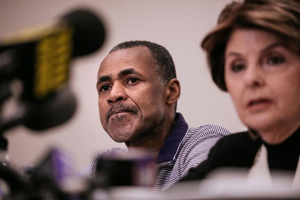 Gloria Allred, seated with Gary Dennis of Pennsylvania, takes questions during a news conference announcing a videotape said to present further evidence of wrongdoing by recording artist R. Kelly Sunday on March 10, 2019, in New York.