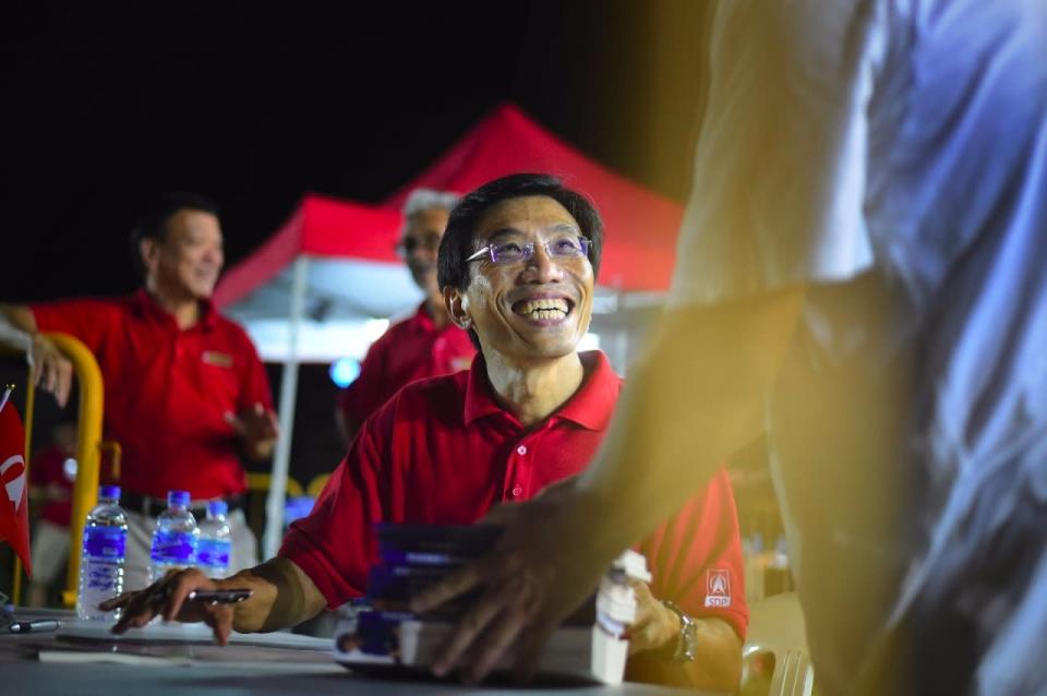 Chee Soon Juan signing copies of his books and meeting supporters after the rally. (Photo: Joseph Nair)