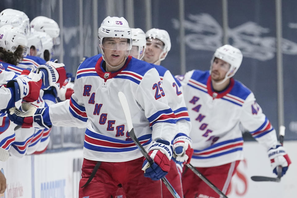 New York Rangers' Libor Hajek (25) celebrates with teammates after scoring during the second period of an NHL hockey game against the New York Islanders Sunday, April 11, 2021, in Uniondale, N.Y. (AP Photo/Frank Franklin II)