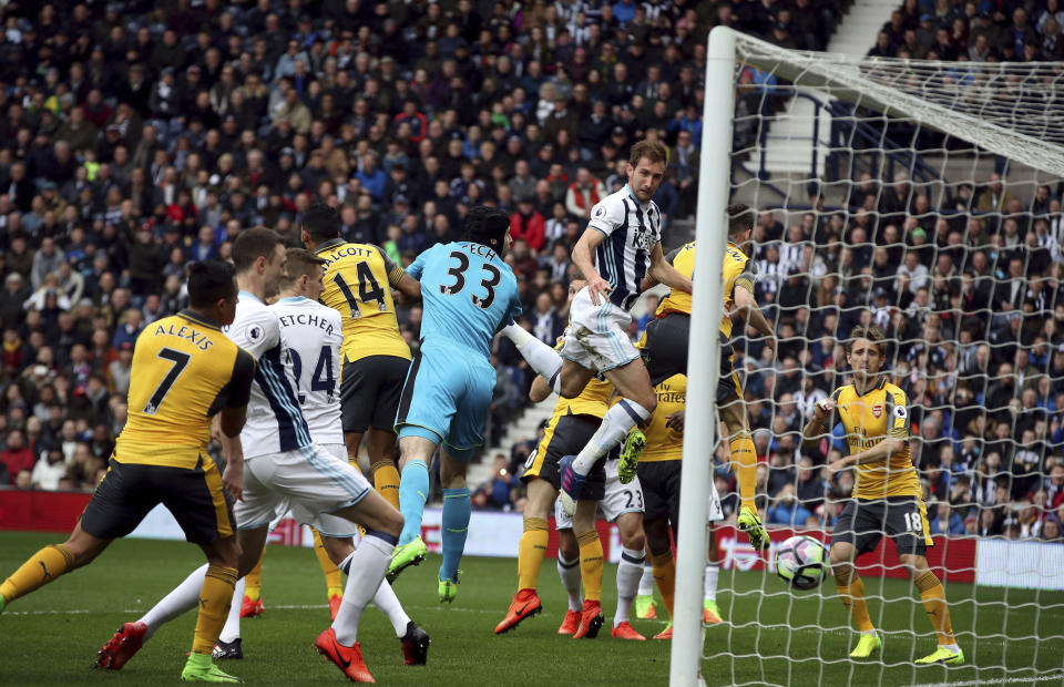 West Bromwich Albion's Craig Dawson scores his side's first goal of the game, during the English Premier League soccer match between West Bromwich Albion and Arsenal, at The Hawthorns, in West Bromwich, England, Saturday March 18, 2017. (Nick Potts/PA via AP)