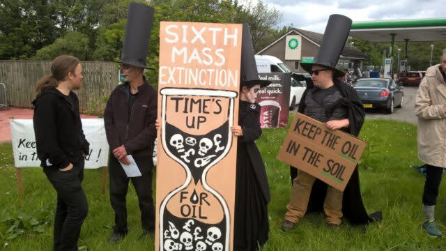 Extinction Rebellion Scotland protesters outside a BP petrol station in Fort William