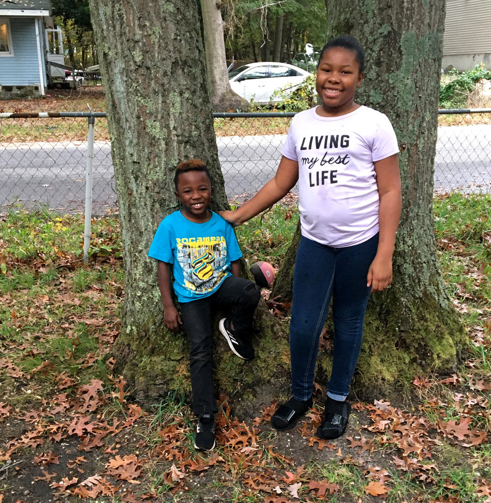 Amiracle, a sixth-grade student in Longwood, on New York's Long Island, with her brother Khalif. (Kevin Johnson)