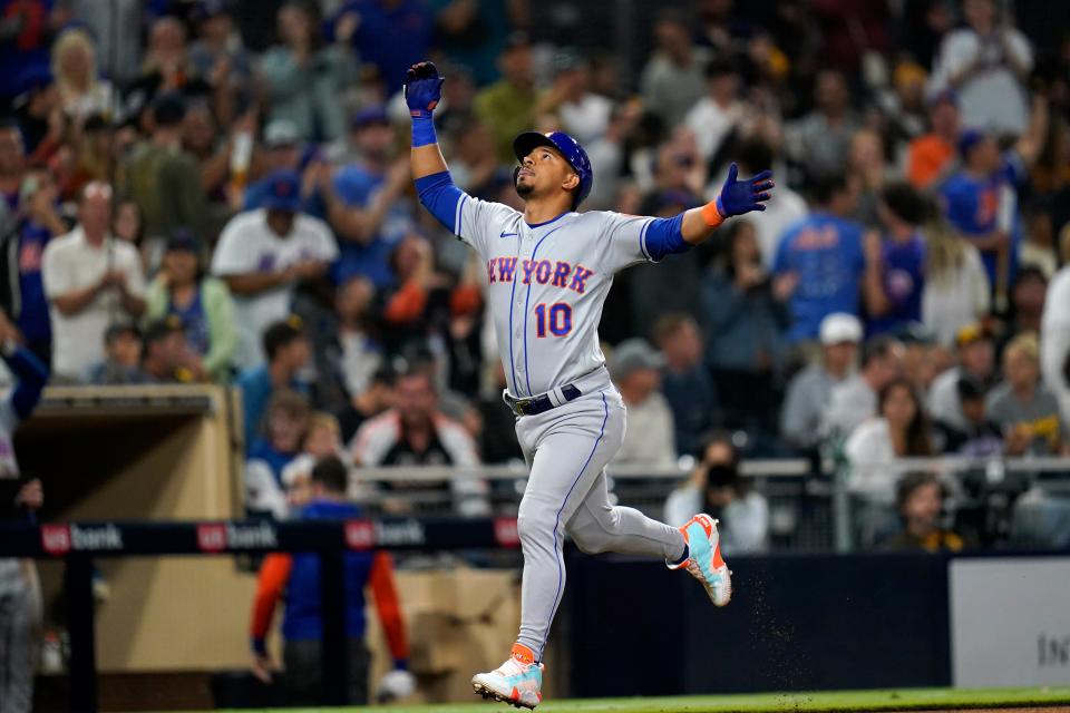 New York Mets' Eduardo Escobar reacts after hitting a two-run home run during the eighth inning of a baseball game against the San Diego Padres, Monday, June 6, 2022, in San Diego.