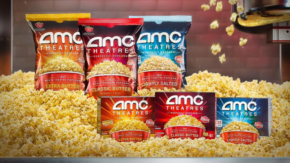 AMC Theatre popcorn packages surrounded by popcorn