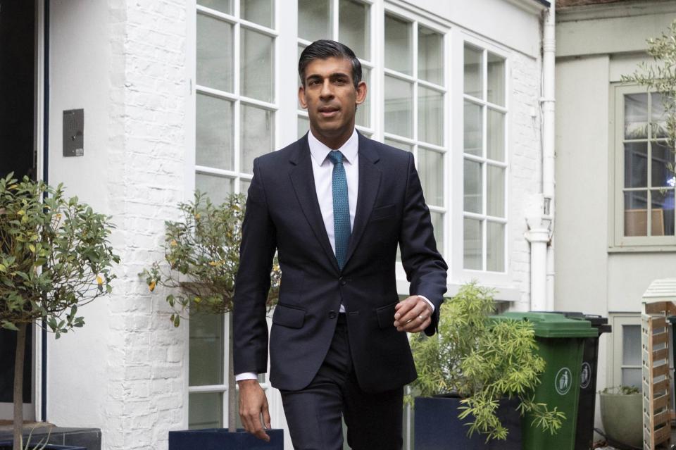 Rishi Sunak outside his home on Friday morning (PA)