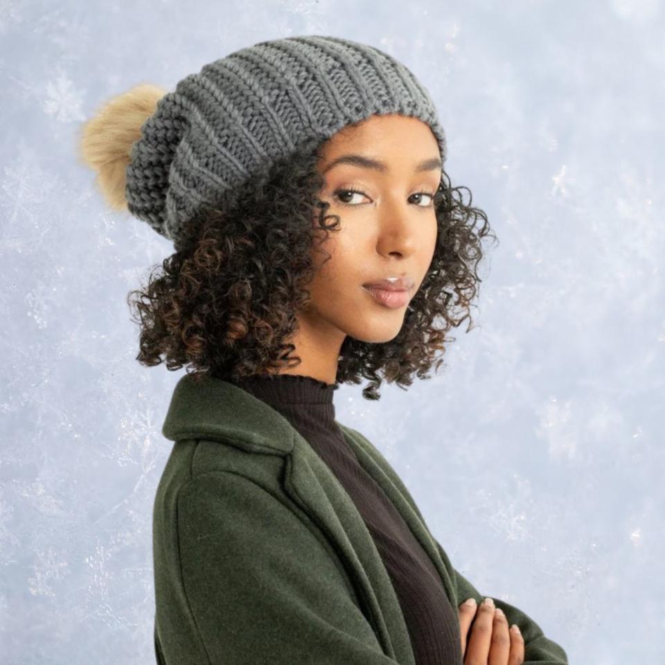 The pom beanie is a timeless accessory that makes a playful appearance every winter. This piece of stretchy headwear features a knitted acrylic body and adjustable drawstrings. It comes in gray, orange, black, cream and tan.You can buy the pom beanie in all colors from Grace Eleyae for $50. 