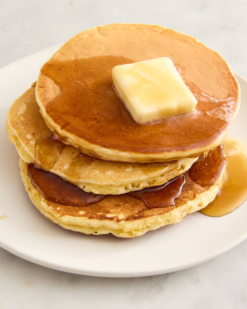 pancakes on a plate with butter and syrup