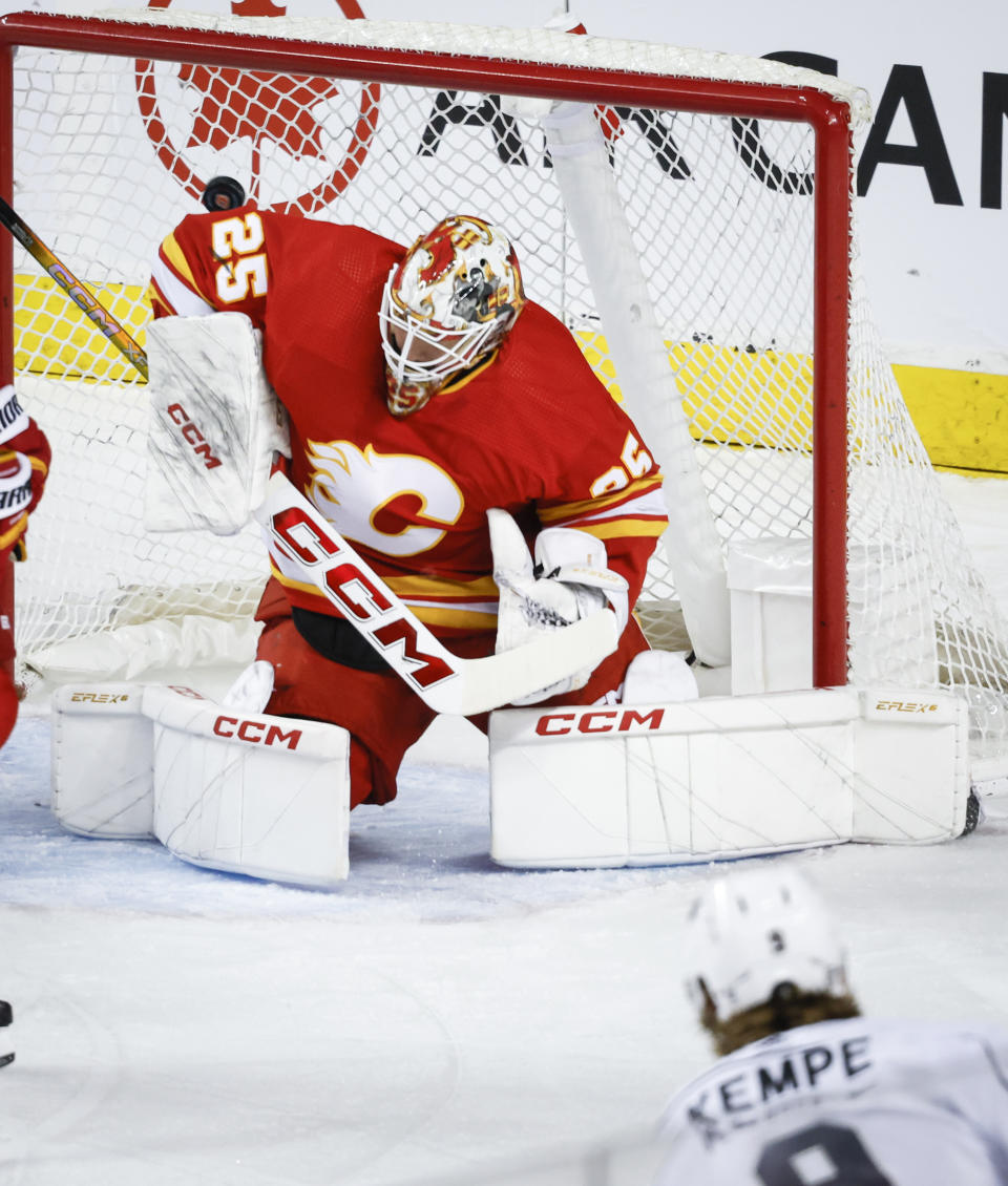 Calgary Flames goalie Jacob Markstrom (25) lets in a goal from Los Angeles Kings forward Adrian Kempe (9) during the first period of an NHL hockey game Saturday, March 30, 2024, in Calgary, Alberta. (Jeff McIntosh/The Canadian Press via AP)