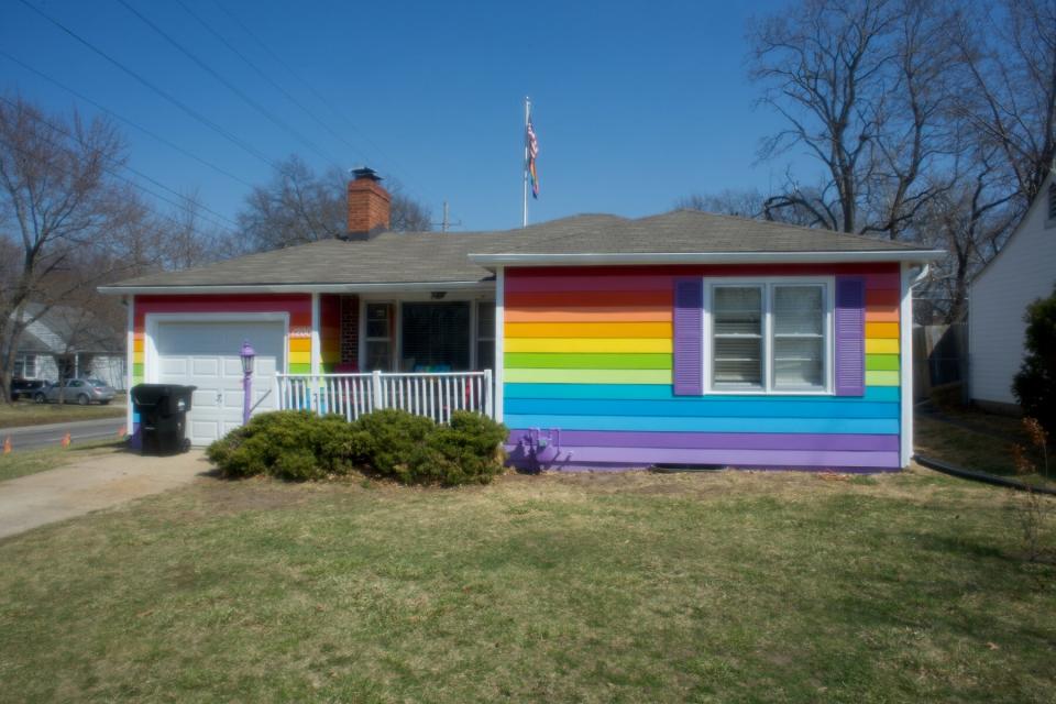 The Rainbow House Topeka Kansas is painted in a rainbow color design