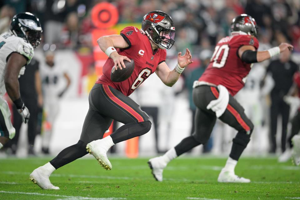 Tampa Bay Buccaneers quarterback Baker Mayfield (6) scrambles for yardage against the Philadelphia Eagles during the first half of an NFL wild-card playoff football game, Monday, Jan. 15, 2024, in Tampa, Fla. (AP Photo/Phelan M. Ebenhack)