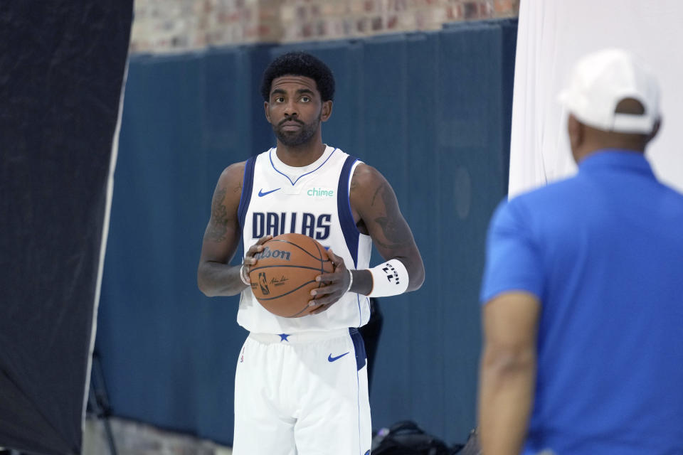 Dallas Mavericks guard Kyrie Irving poses for photos during a NBA basketball media day in Dallas, Friday, Sept. 29, 2023. (AP Photo/LM Otero)