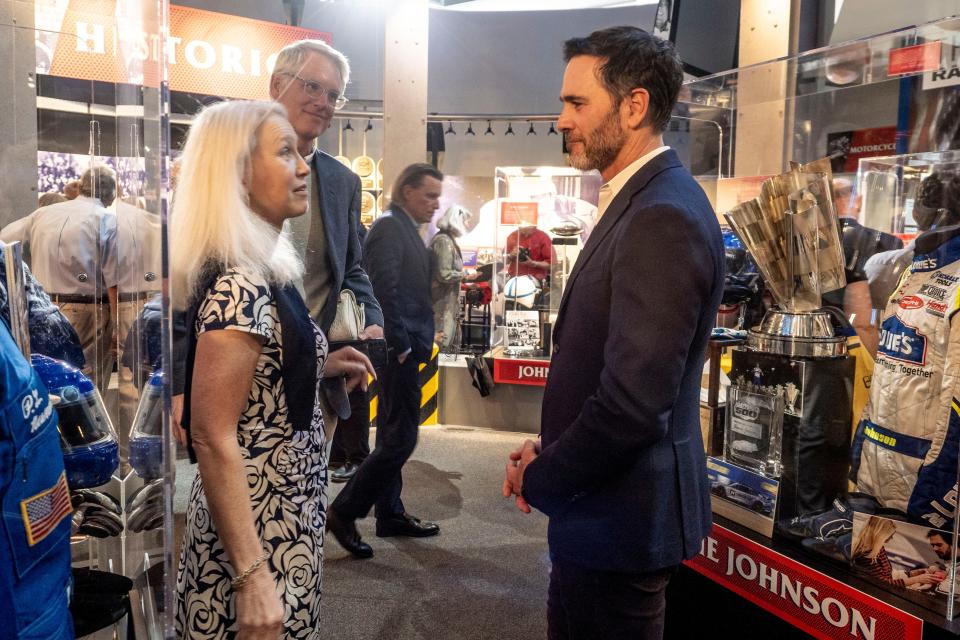 Jimmie Johnson visits with Clea Newman Soderlund, daughter of another 2024 inductee, Paul Newman.