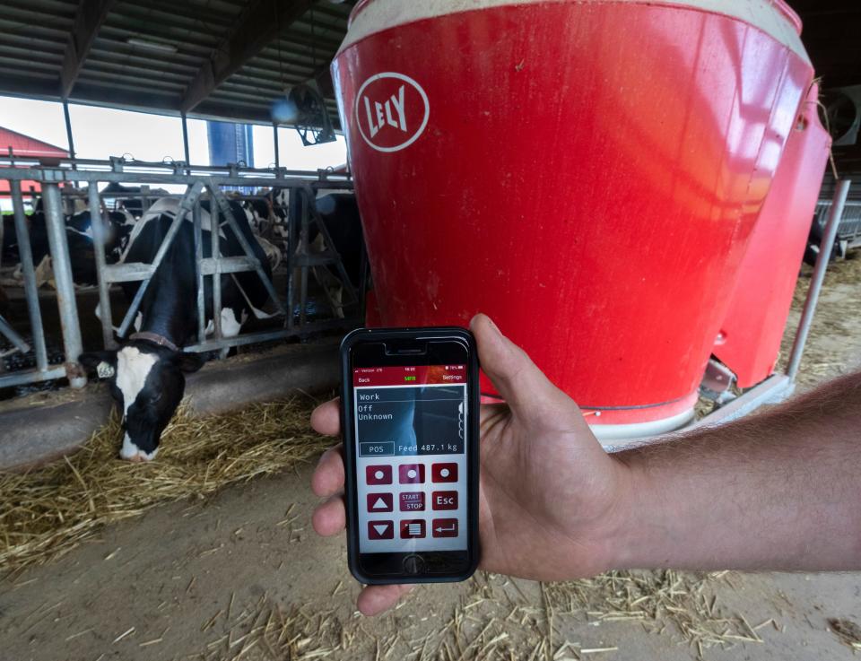 Max Malm displays an app on his phone that he uses to communicate with a robotic feeder at  Malm's Rolling Acres Farm in Loyal. It was the the first  farm in Wisconsin to operate a Lely Vector automatic feeding system, which was installed in December of 2017. The Vector feed system works 24 hours a day, measuring and mixing rations for the different groups of cows on the farm. Such high tech innovations are transforming agriculture.