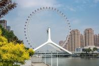 <p>The <a href="https://www.tripadvisor.com/Attraction_Review-g311293-d1986258-Reviews-Ferris_wheel_Eye_of_Tianjin-Tianjin.html" rel="nofollow noopener" target="_blank" data-ylk="slk:Tianjin Eye;elm:context_link;itc:0;sec:content-canvas" class="link ">Tianjin Eye</a> in China is one of the only ferris wheels in the world built over a bridge. The compartments hold eight people at a time, and there are 50 of them, meaning that it can hold about 800 riders an hour, so it's very efficient. The unique placement of the ferris wheel gives riders amazing views of Tianjin and the river below. </p>