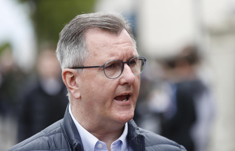 Jeffrey Donaldson leader of the Democratic Unionist Party speaks to the media while out canvassing in Holywood on the outskirts of Belfast, Northern Ireland, Monday, May 2, 2022. The DUP leader was out election campaigning ahead of Thursday's local election. (AP Photo/Peter Morrison)