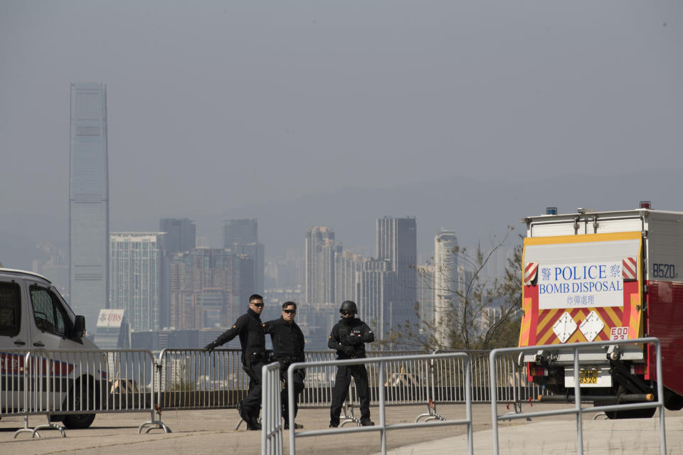 Members of the bomb disposal squad gather during a demonstration for media in Hong Kong, Friday, Dec. 6, 2019. Hong Kong's much-maligned police force provided a rare behind-the-scenes look Friday at its bomb disposal squad to show the potentially deadly destructive force of homemade explosives seized during months of protests that have shaken the Chinese territory. (AP Photo/Vincent Thian)