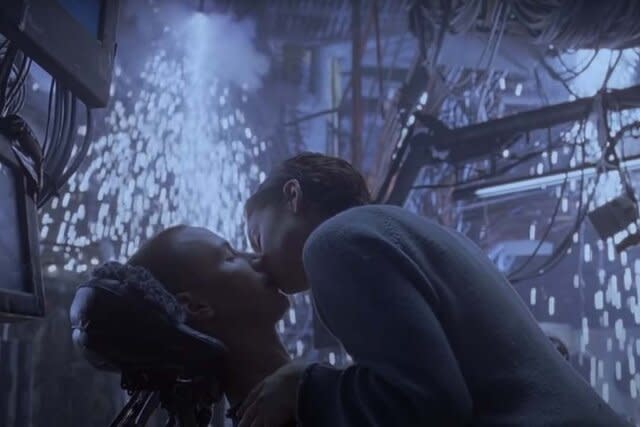 Screenshot 2023 09 06 At 10.27.13 AmaTrinity (Carrie-Anne Moss) kisses Neo (Keanu Reeves) as sparks fly amongst cables  in The Matrix (1999)