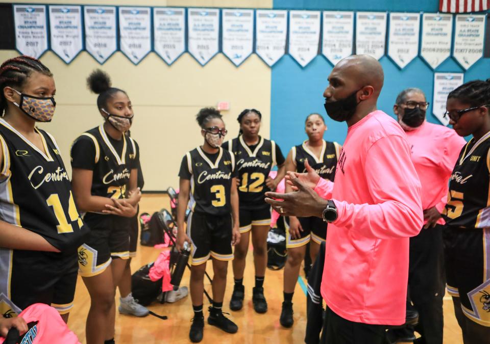 Central High School girls head basketball coach Deshawn Pendleton talks with his players during the game at North Oldham High School Tuesday night. March 6, 2021