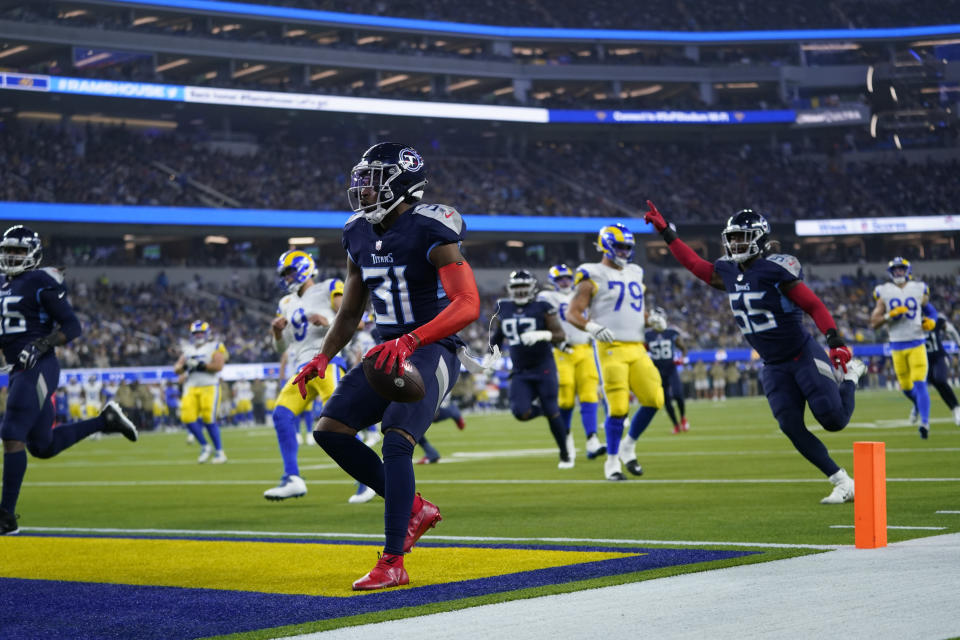 Tennessee Titans free safety Kevin Byard scores a touchdown after grabbing an interception during the first half of an NFL football game against the Los Angeles Rams Sunday, Nov. 7, 2021, in Inglewood, Calif. (AP Photo/Ashley Landis)