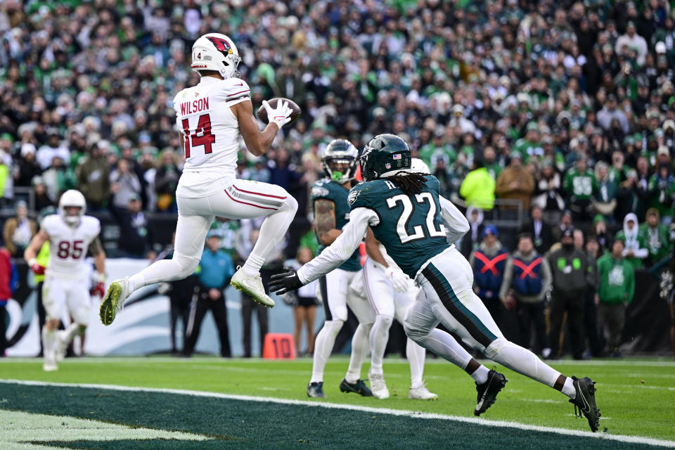 Arizona Cardinals wide receiver Michael Wilson, left, catches a touchdown pass in front of Philadelphia Eagles cornerback Kelee Ringo (22) during the second half of an NFL football game, Sunday, Dec. 31, 2023, in Philadelphia. (AP Photo/Derik Hamilton)