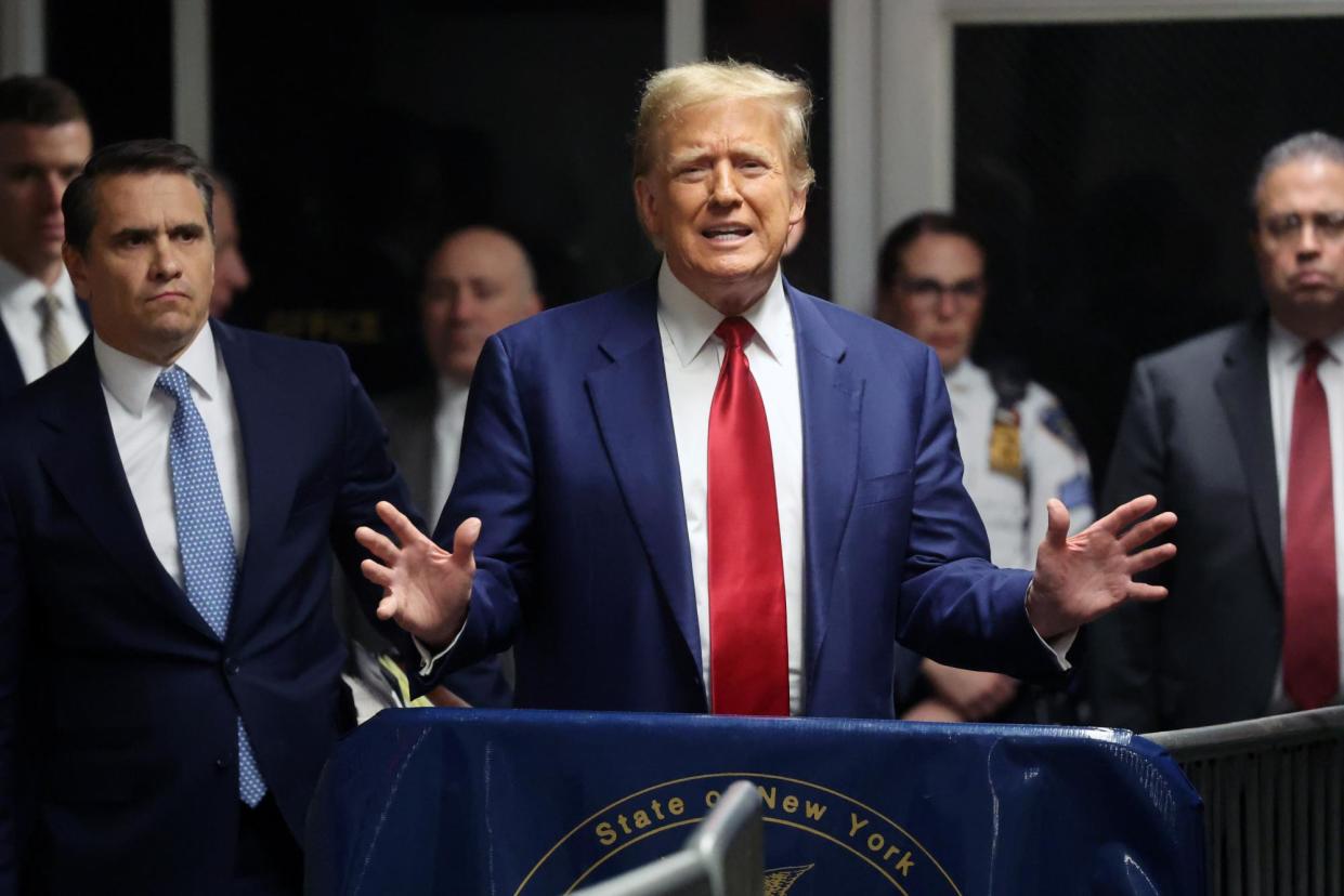 <span>Donald Trump speaks to the media after a pre-trial hearing in a hush money case in criminal court in New York, New York on 25 March 2024.</span><span>Photograph: Spencer Platt/EPA</span>
