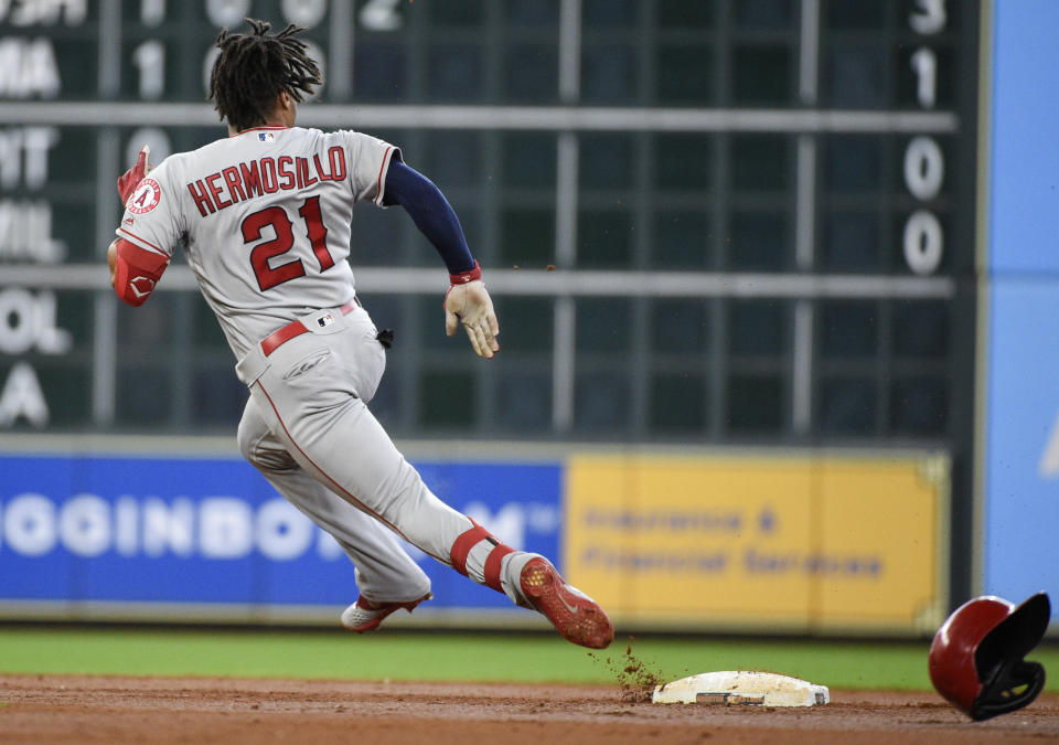 Los Angeles Angels' Michael Hermosillo runs to third after hitting a triple during the second inning of a baseball game against the Houston Astros, Sunday, Sept. 22, 2019, in Houston. (AP Photo/Eric Christian Smith)