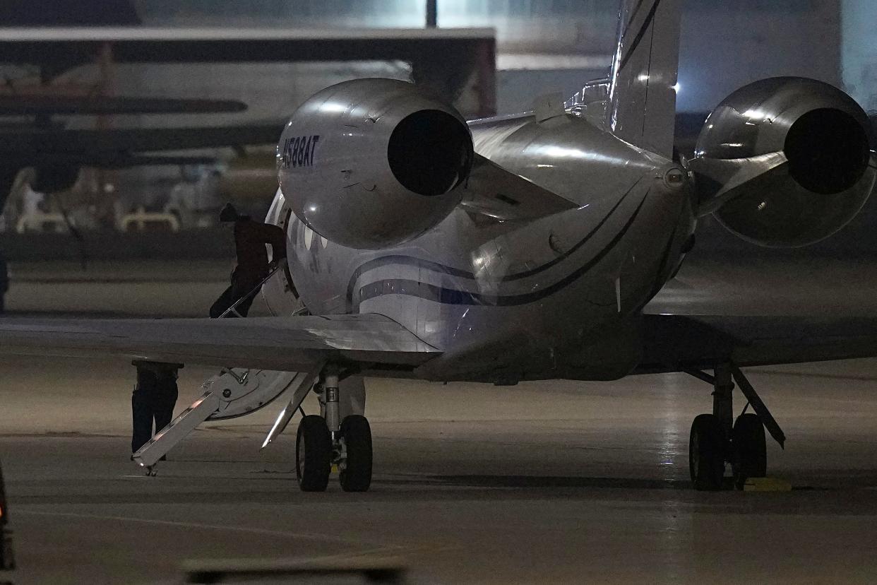 WNBA star Brittney Griner deplanes at Kelly Field in San Antonio, Texas, following her release in a prisoner swap with Russia, Friday, Dec. 9, 2022.